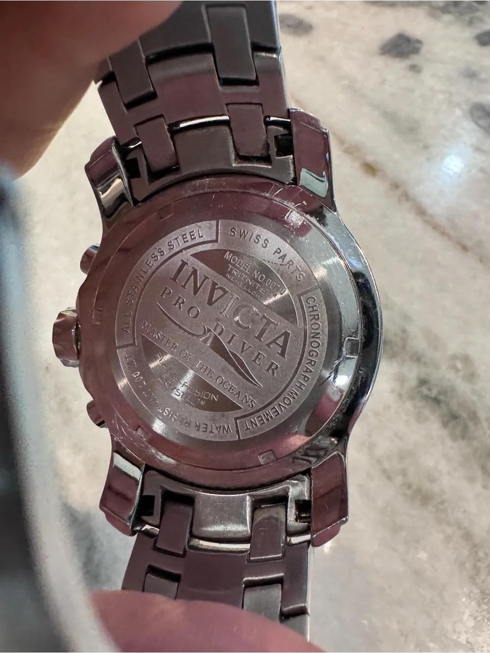 Invicta Silver Stainless Steel Watch with Black Bezel and Dark Dial